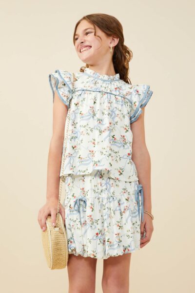 Oberteil mit kontrastfarbenem Besatz und floralem Schleifenmuster